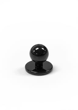 A black chef jacket button with a rounded top and a flat base. The item is shiny and simple in design.