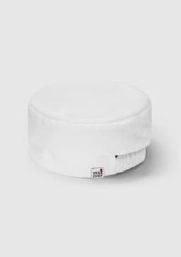 A white mesh flat top hat with an elastic band and a logo tag. Suitable for various headwear occasions.