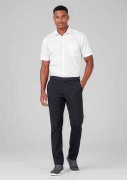 A man in a white shirt and black slacks, standing against a neutral background. The slacks have a flat front and feature a logo.