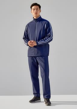 A model wearing unisex navy track pants paired with a matching zip-up jacket featuring white stripes.