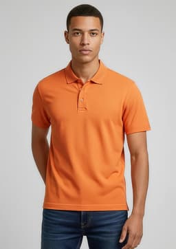An orange polo shirt with a collared neckline, featuring a logo, worn by a model against a neutral background.