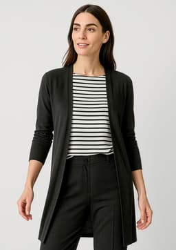 A longline cardigan in black, featuring a sleek design and open front. The model wears it over a striped top and black pants.