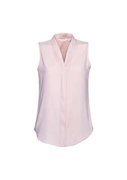 A light pink sleeveless top with a v-neck and a subtle draped design. It features a brand logo.