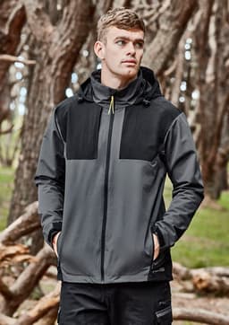 A unisex waterproof jacket in grey and black features a hood and branding. Set against a natural background with trees.