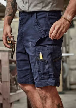 Work shorts in navy blue with multiple pockets and a pencil visible in the side pocket. Features a logo.