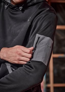 A black unisex water resistant hoodie featuring a zippered pocket on the sleeve and a drawstring hood.