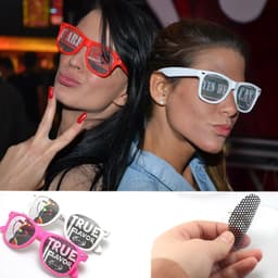 Novelty pinhole eyeglasses in pink and white, featuring unique designs and mesh lenses, ideal for fun parties.