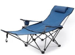 A blue camping lounge chair with a reclining design, armrest, and a small headrest pillow. It has a logo on the frame.