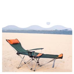 A green and orange camping lounge chair is set up on a sandy beach, facing a calm ocean.