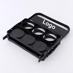 A black beer basket with four circular holders and a handle, featuring a logo on the front.