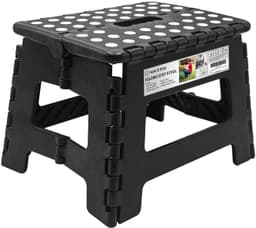 A black folding step stool with white dots on the surface, featuring a compact design and a logo.