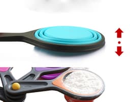 A set of three pop out silicone measuring cups in various vibrant colours, stacked and displayed on a flat surface.