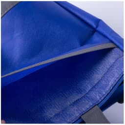 A blue lunch cooler tote with a grey lining and an open zipper revealing the interior compartment.