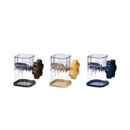 A manual mashing and grinder in three colours: brown, yellow, and navy blue, featuring a clear compartment and a handle.