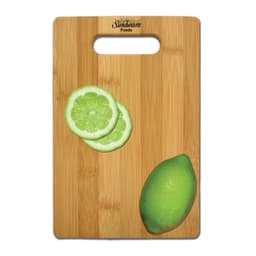 A bamboo cutting board with a handle cutout, featuring lime slices and a whole lime, and displaying a logo.