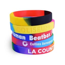 A collection of segmented silicone wristbands in various bright colours, with branding on some bands.