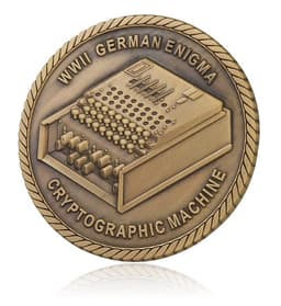 A bronze challenge coin featuring a relief of a WWII German Enigma cryptographic machine, with a rope border design.