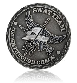 A custom-shaped, die-struck challenge coin in antique silver featuring a SWAT team design and a logo.