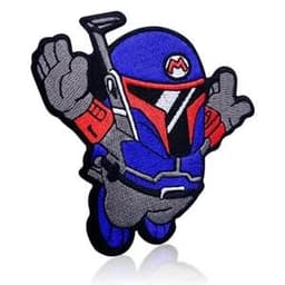 A blue and grey embroidered patch of a cartoon character in a helmet, resembling a space-themed figure.