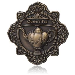 A 3D die cast lapel pin in bronze featuring a teapot design with ornate framing and the text "Queen's Tea 2018."