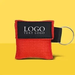 A red custom CPR face shield mask keyring with a black fabric patch and ring attachment.