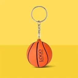 An orange basketball stress reliever keychain features a silver keyring and a logo.