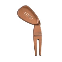 A brown divot tool repair fixer with a ball marker, featuring a logo on the top.