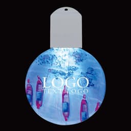 A round, acrylic holiday ornament showcases a vibrant, full-colour design featuring festive imagery and a logo.