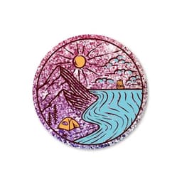 A round glitter sticker featuring a purple and pink landscape with mountains, a river, a tent, and a sun.