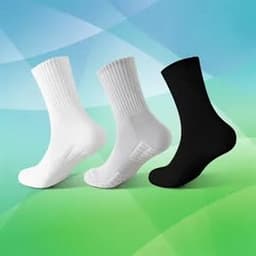 Three pairs of sports socks in white and black, featuring cushioned soles and a non-slip design.