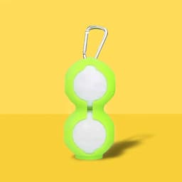 A green silicone golf ball holder featuring a carabiner, designed to securely hold two golf balls.