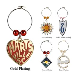 A set of colourful wine charms featuring various designs, including a heart, sun, and waves, with gold and nickel plating.