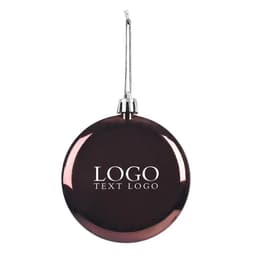 A shatter-resistant, flat round Christmas ornament in a deep burgundy colour with a hanging silver string and logo.