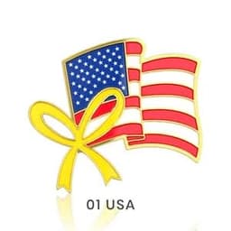 A gold lapel pin featuring a red, white, and blue American flag alongside a yellow ribbon.