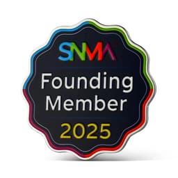 A circular badge with a black background and colourful edges, featuring the text "Founding Member 2025" and a logo.