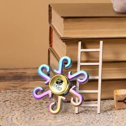 A rainbow fidget spinner with a stylish design, featuring a central logo and vibrant, iridescent colours.