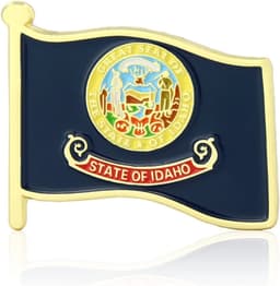 A gold and navy flag pin featuring the state emblem of Idaho. The pin has a decorative design and a shiny finish.