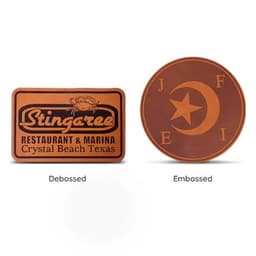Two leather patches in brown; one is debossed with a logo, and the other is embossed with a star and crescent design.