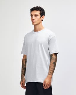 A heavyweight cotton unisex T-shirt in light grey, featuring a crew neck and short sleeves. It has a logo on it.