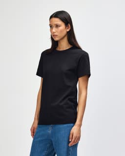 A unisex heavyweight cotton T-shirt in black, featuring a standard crew neck and short sleeves, with a logo.