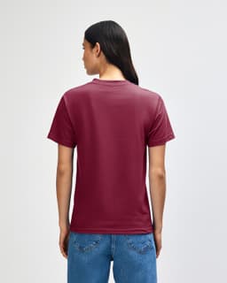 A heavyweight unisex t-shirt in burgundy, featuring a simple design and a visible logo on the back.