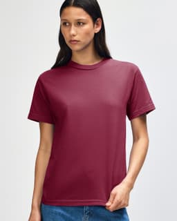 A maroon heavyweight cotton unisex T-shirt with short sleeves and a simple design. It has a logo on the chest.