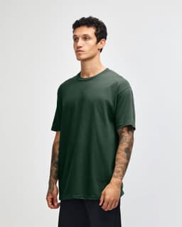A heavyweight cotton unisex T-shirt in deep green, featuring a crew neck and short sleeves. The design includes a logo.