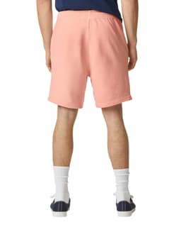 Lightweight sweatshorts in a soft coral colour, featuring an elastic waistband and a logo.