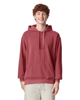 A red adult hooded sweatshirt featuring a front pocket and a logo. The model has a relaxed fit with the hood up.