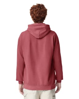 A hooded sweatshirt in a deep red colour, featuring a back view of a person wearing it. The design includes a logo.
