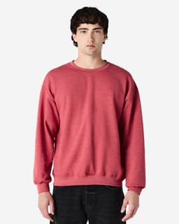 A red Gildan Heavy Blend adult crewneck sweatshirt displayed on a model, featuring a simple design and fitted silhouette.