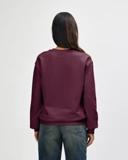 A maroon Gildan Heavy Blend adult crewneck sweatshirt with a simple design, featuring a logo.