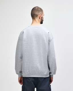 A grey Gildan Heavy Blend adult crewneck sweatshirt featuring a plain back design.