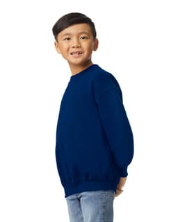A youth sweatshirt in navy blue, featuring a simple design and long sleeves, worn by a smiling child.